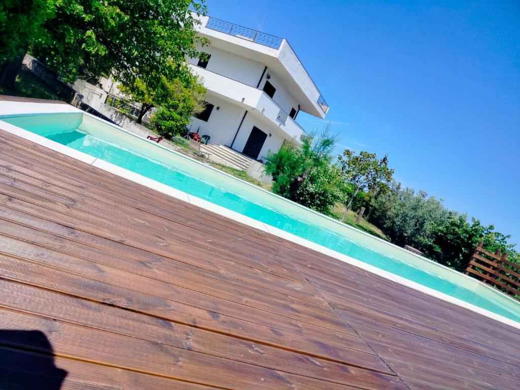 a swimming pool in front of a house at Villa Vit The Adriatic Experience in Vasto