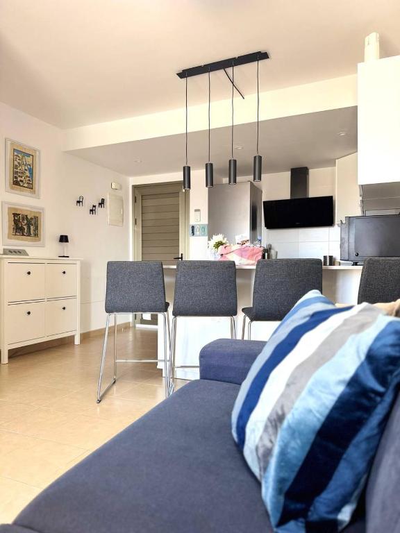 a living room with a bed and a dining room at NextGen Casa Pepa I Terrace & Pool Fuerteventura in Costa de Antigua