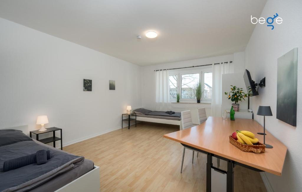 a living room with a table with bananas on it at BEGE APARTMENTS ProStay in Lüdenscheid