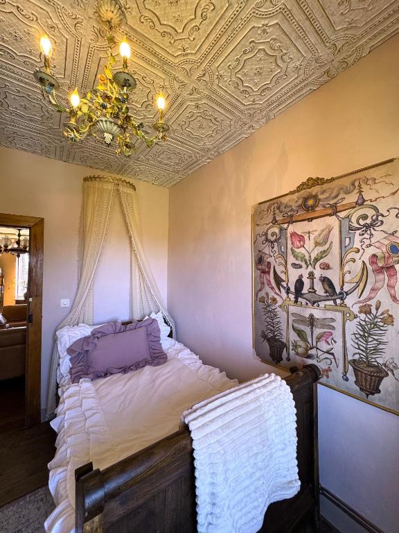 a bedroom with a bed with a coffered ceiling at Charming 19th-Century BB in Saint-Martial-le-Mont, Creuse in Saint-Martial-le-Mont