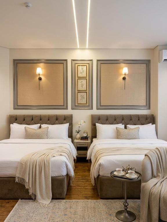 a bedroom with two beds and a couch at New LH Cairo Hotel in Cairo