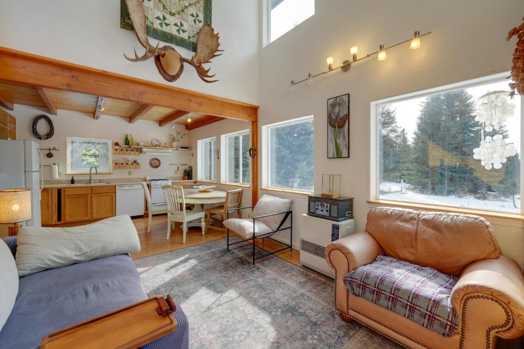 a living room with a couch and a dining room at Bring Your Pets! Secluded Homer Escape w/ Deck in Homer