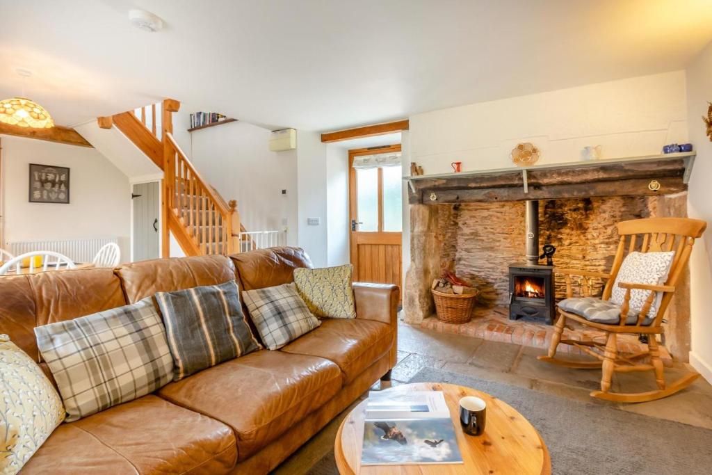 a living room with a couch and a fireplace at 1 Bed in Taunton oc-bartc in West Monkton