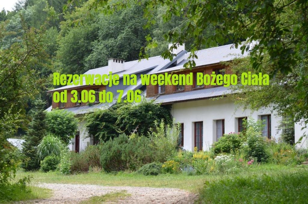 a building with a sign on the side of it at Hajstra in Krempna