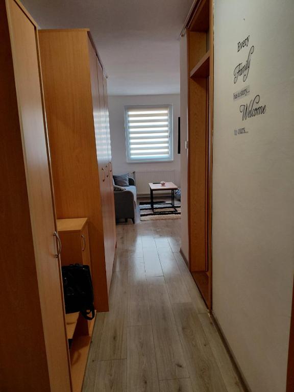 a hallway of a room with a door and a living room at LOBO stan na dan in Lukavica