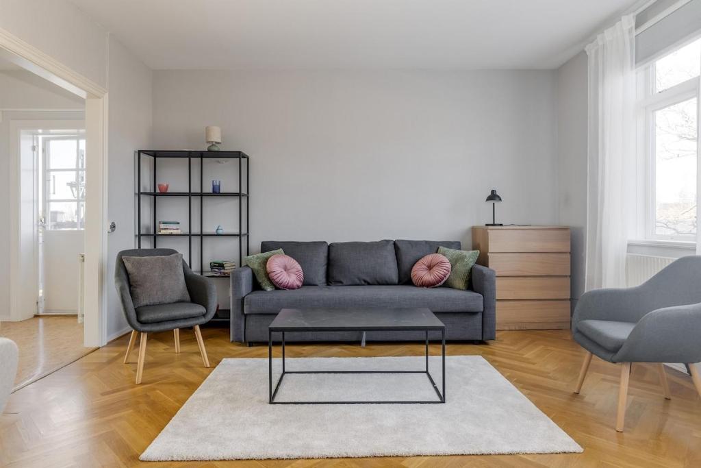 a living room with a couch and two chairs at Functional and Spacious Apartment in Kopparberg in Kopparberg