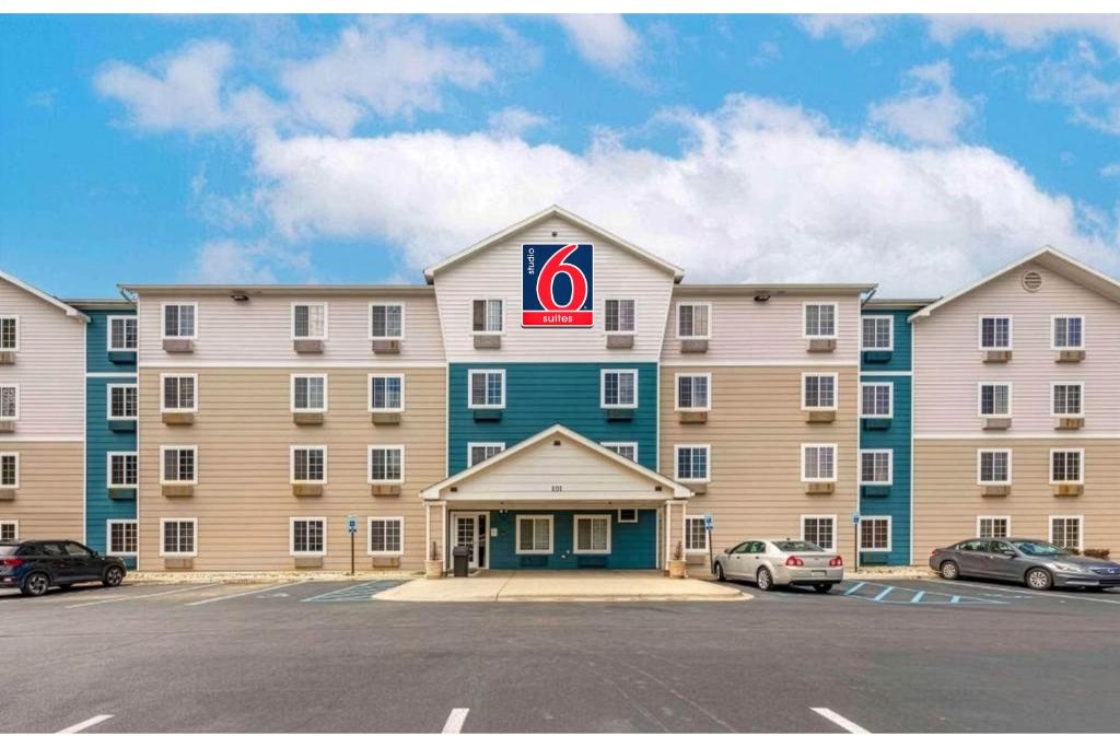 a large hotel with a sign on the front of it at Studio 6 Extended Stay Birmingham Pelham AL in Pelham