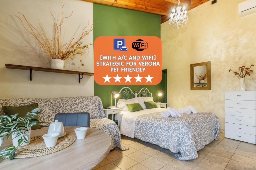 a bedroom with two beds and a sign on the wall at Le Dimore Apartments - Garden & Private Parking in Verona