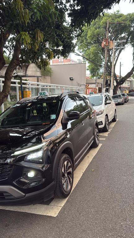 a black car parked on the side of a street at Wallace in São Paulo