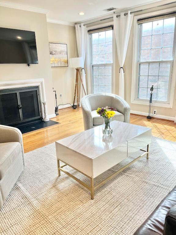 a living room with a white coffee table at Downtown house w On-site Parking Walk to Capital, Museums B in Washington, D.C.