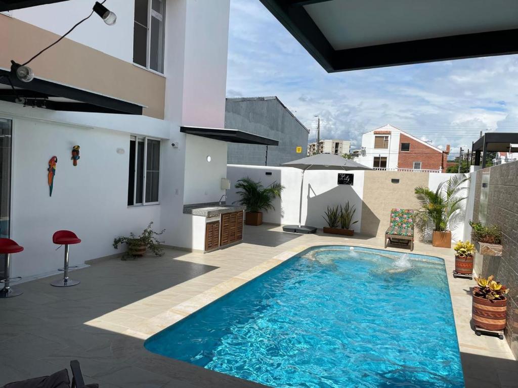 a swimming pool on the patio of a house at Casa de Descanso Lili in Ricaurte