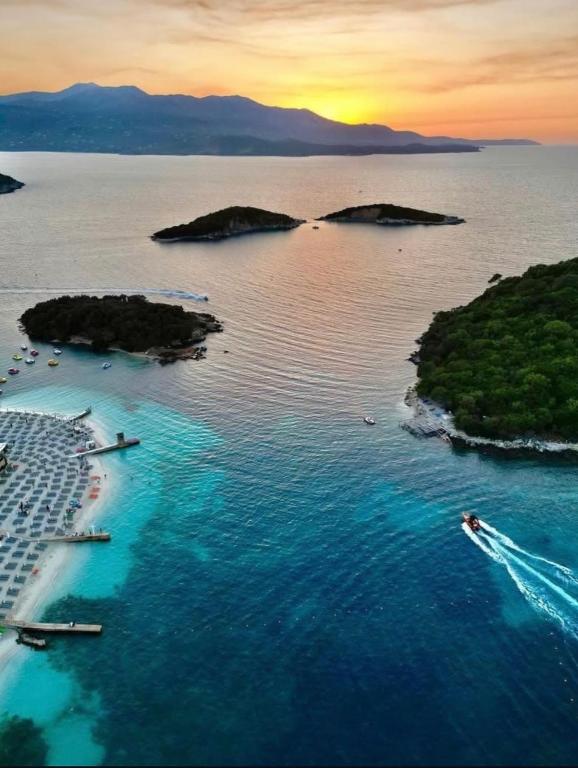 an aerial view of an island in the water at ABOJA Inn in Ksamil