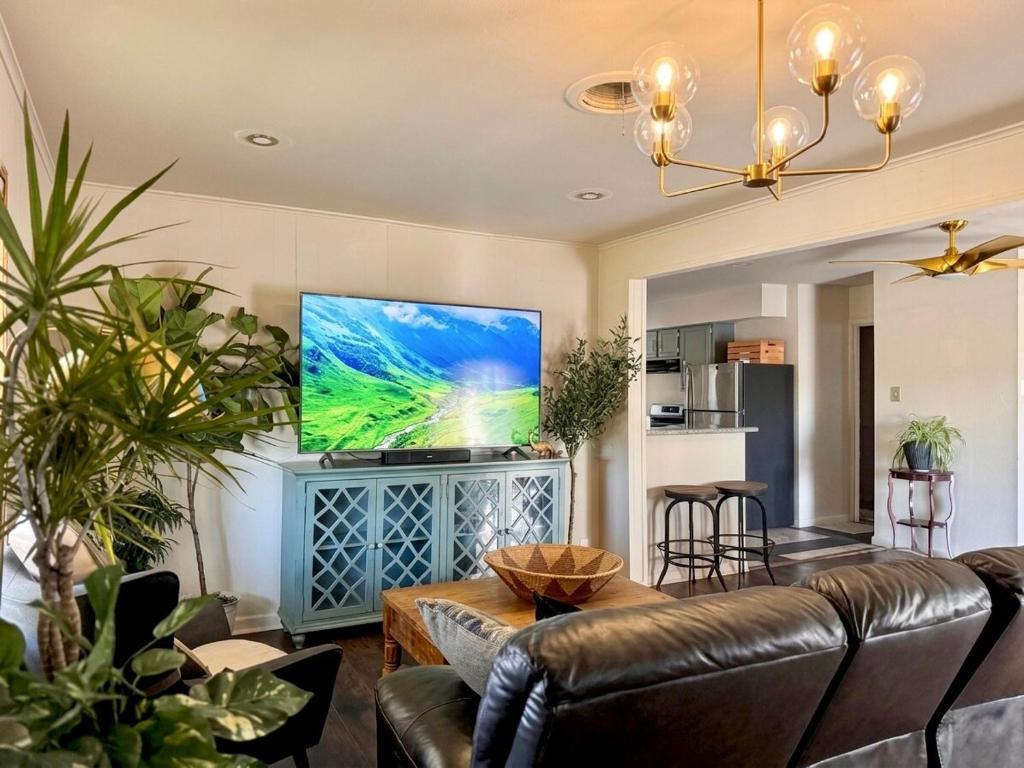 a living room with a couch and a flat screen tv at Lux Modern 3BR King Bed Smart TV PetFriendly in Killeen