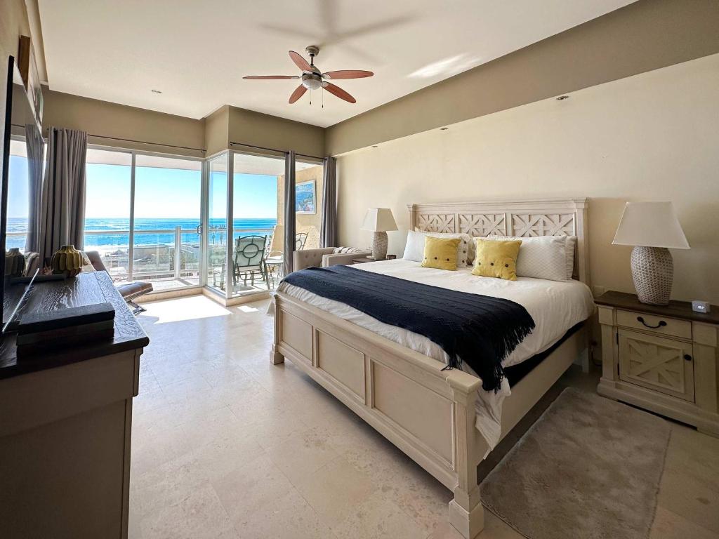 a bedroom with a bed and a view of the ocean at Beachfront Condo with Stunning Views Tranquil Stay in Puerto Peñasco