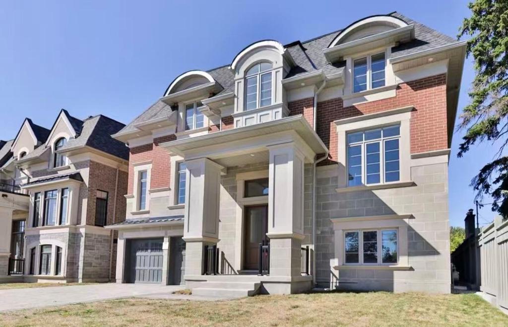 a large brick house with at B-Willowdale Cummer Residence -Queen bedroom near Yonge-Finch in Toronto