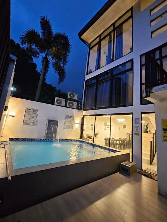 a large swimming pool in front of a building at View Deck Private Pool in De La Paz