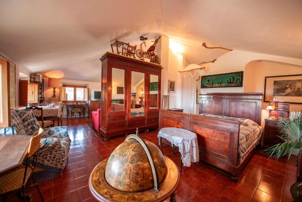 a living room with a large room with a large table at Mansarda Vista Mare Nel Verde in Quercianella