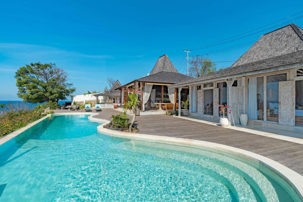 an image of a house with a swimming pool at Dolce Vita Villa in Sampalan