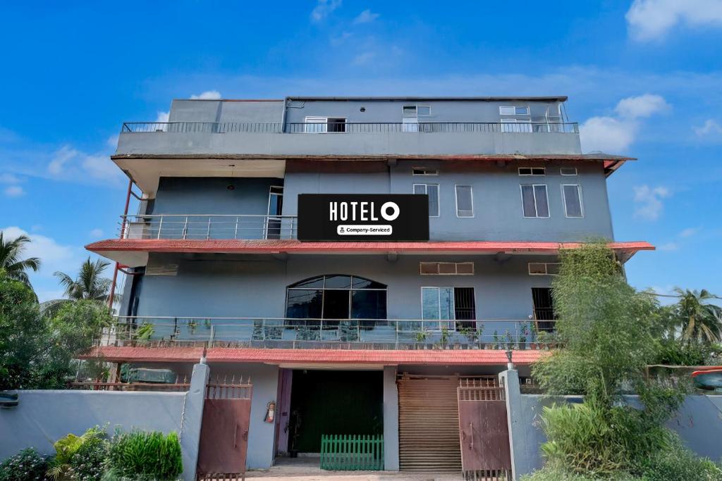 a building with a sign on the side of it at Hotel O Garchuk Market Formerly Trendz Stay in Guwahati