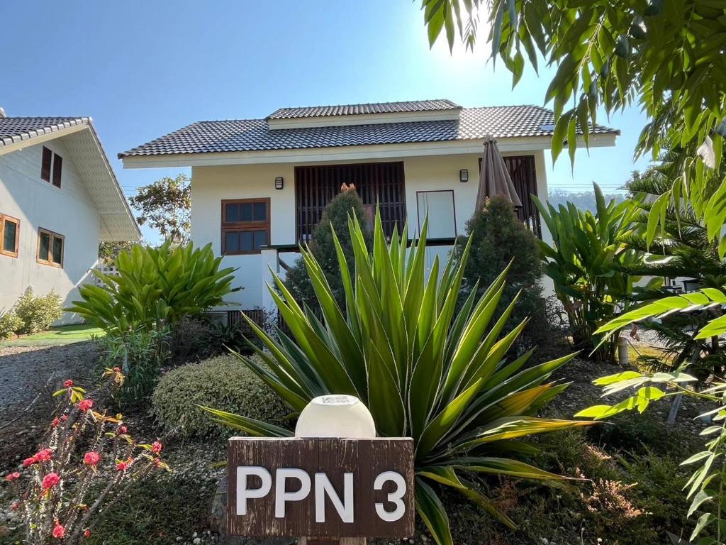 a house with a sign in front of it at พรพนาฮิล4 in Lamphun