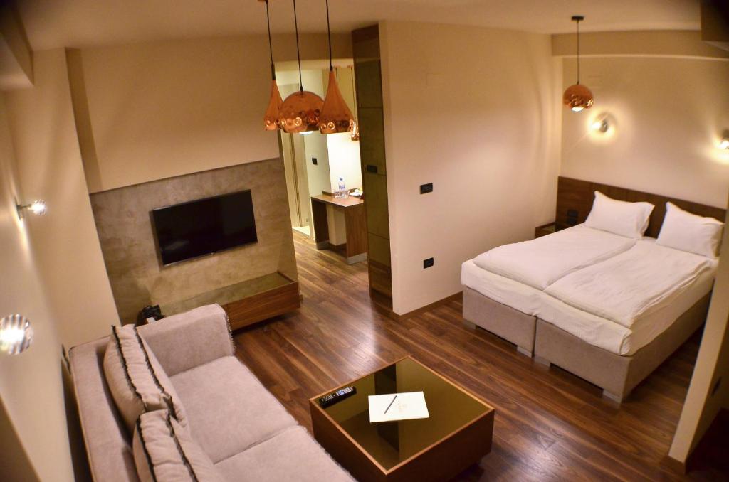 Postel nebo postele na pokoji v ubytování Hotel Vlaho