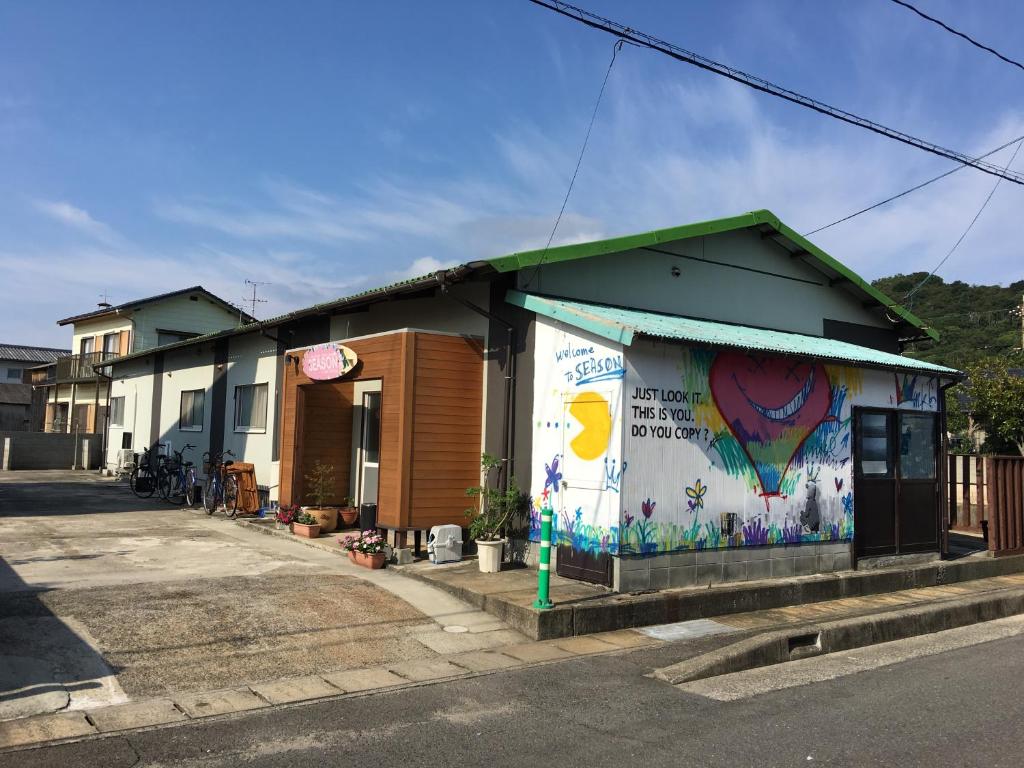 a building with a mural on the side of it at Season 2 in Naoshima