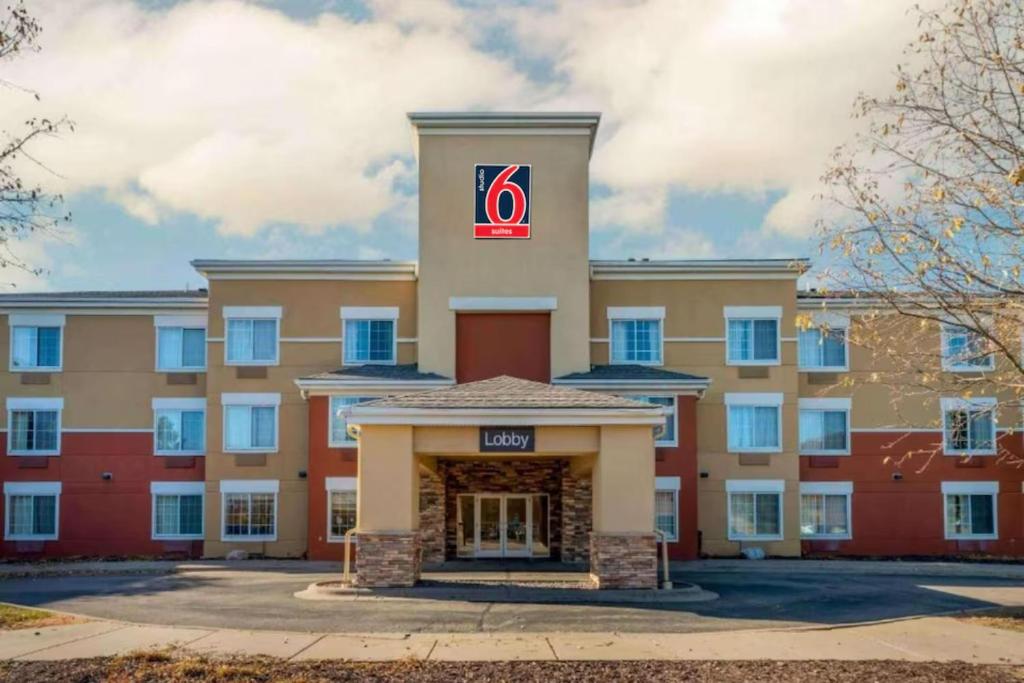 a large building with a sign on top of it at Studio 6 Extended Stay Minneapolis Airport Eagan North MN in Eagan