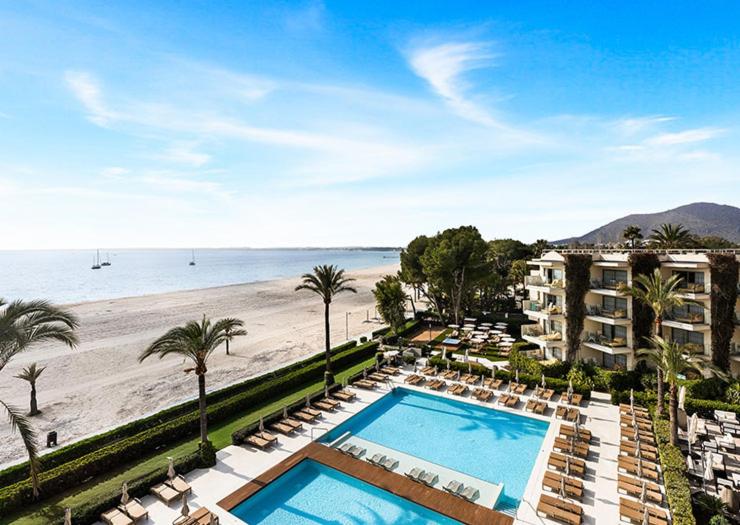 a view of a resort with a swimming pool and a beach at VIVA Golf Adults Only 18+ in Port d'Alcudia