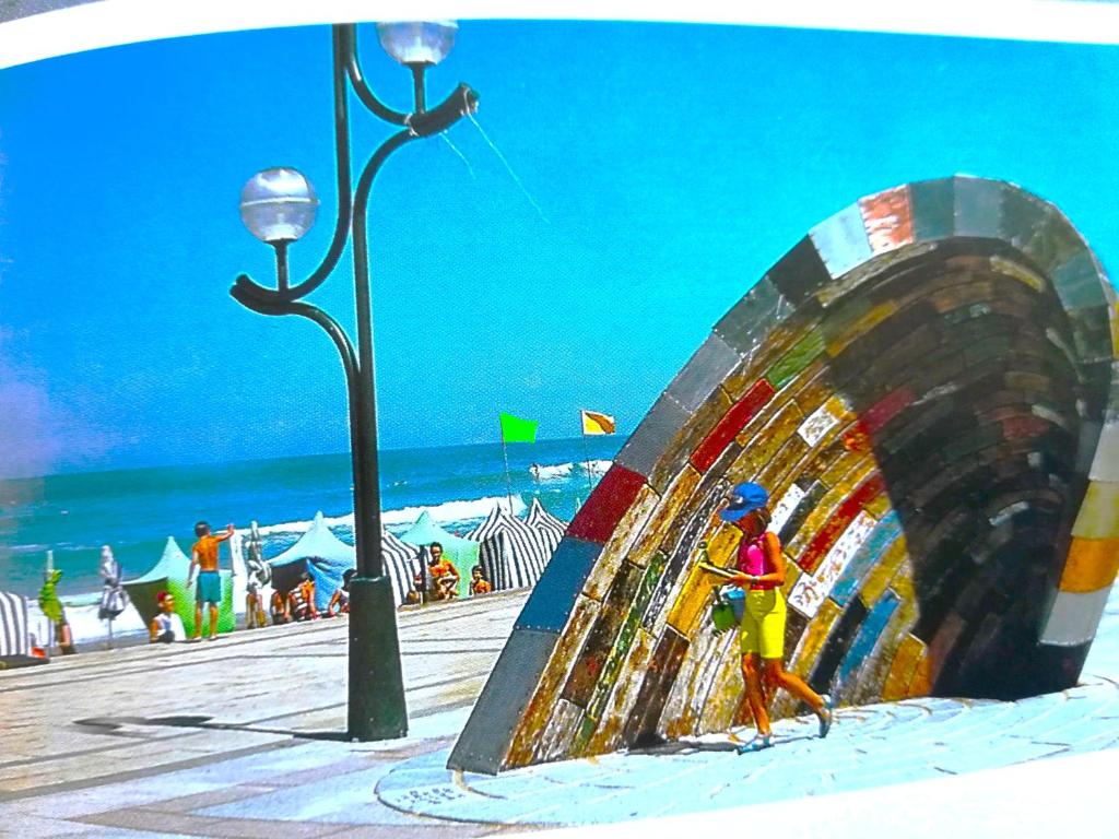 a lego figure of a man walking on the beach at alaia apartamento in Zarautz