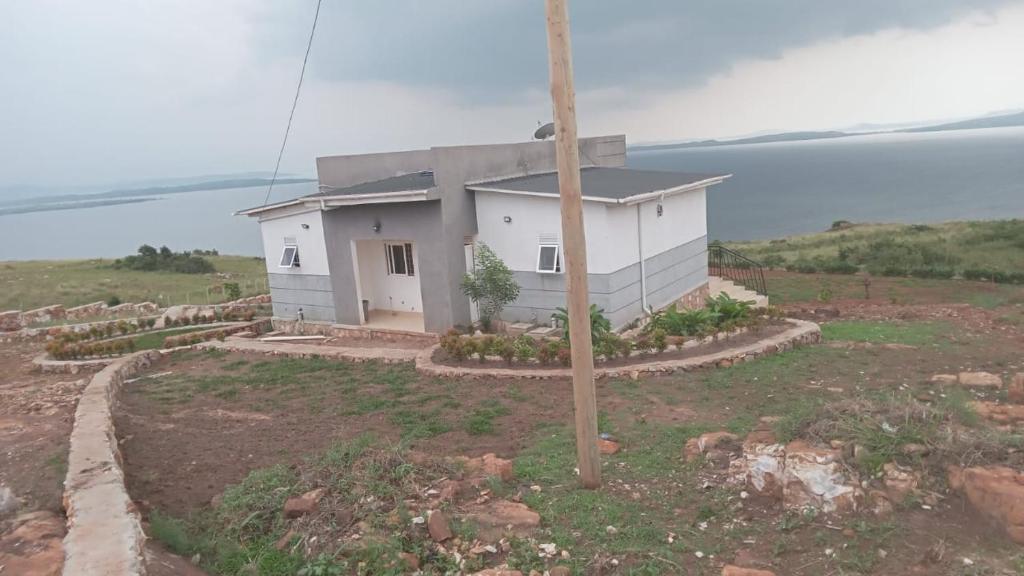 a house on top of a hill with the ocean at Marakunda - Victoria in Jinja