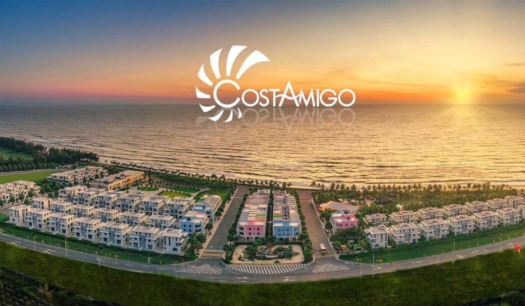 an aerial view of a resort near the ocean at Costamigo Phan Thiet, BW Premier Collection in Phan Thiet