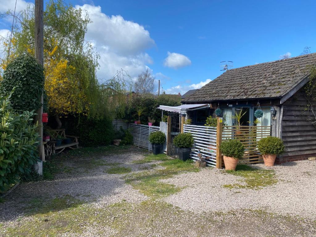 a house with plants in front of it at The Pheasant's Nest in Welland