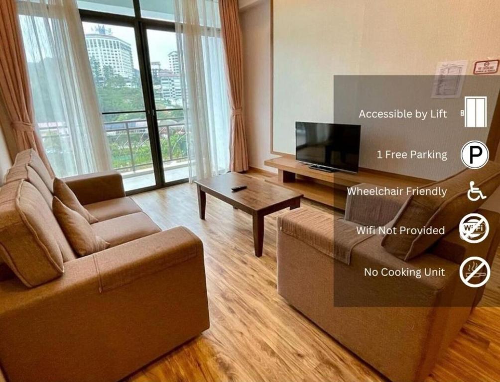 a living room with a couch and a tv at PLAY at Nova Retreat Kea Farm in Cameron Highlands