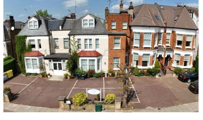 an aerial view of a large house with a parking lot at Caterine lodge in Whetstone