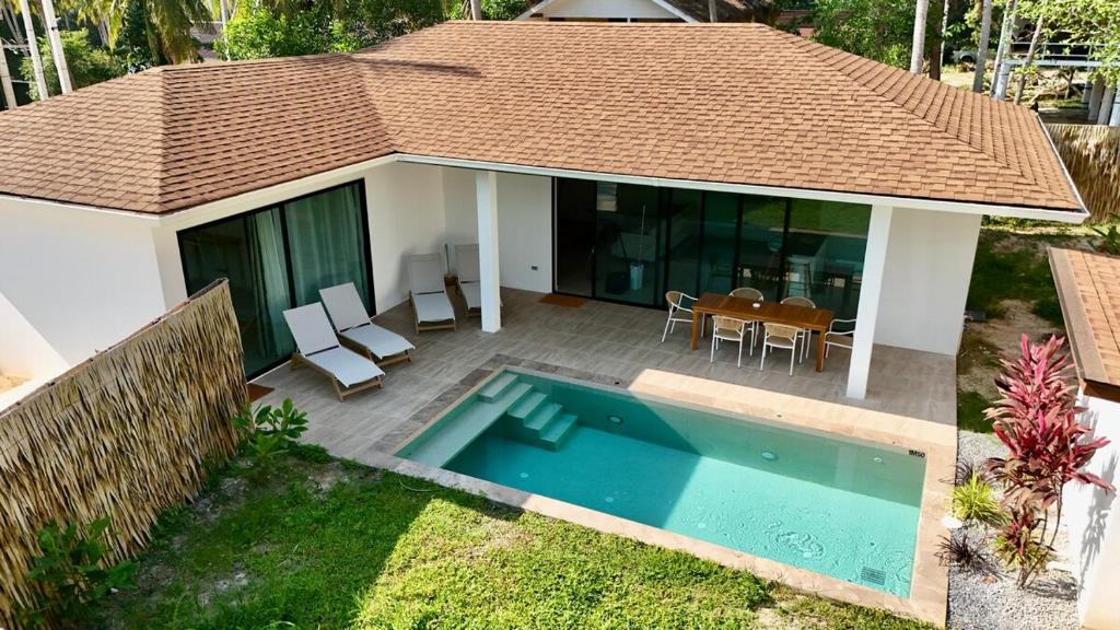 an aerial view of a house with a swimming pool at Samma Villas - Ruby Villa - 2 BDR & private pool in Ko Phangan