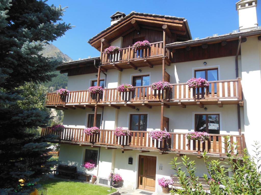 a building with flower boxes on the balconies at Casa Alfredo in Cogne