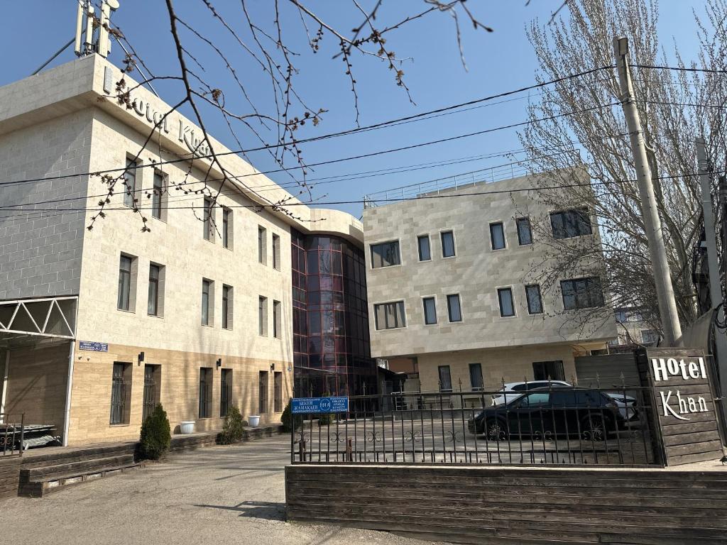 a building with a car parked in front of it at Khan Boutique Hotel in Almaty
