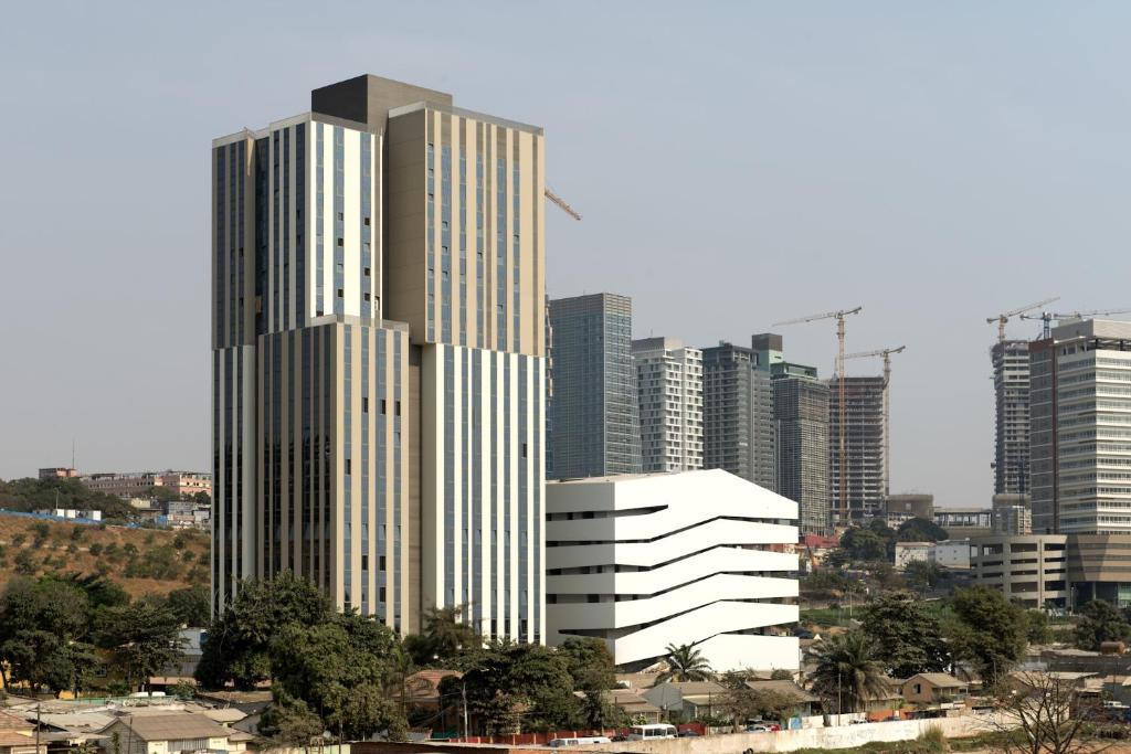a group of tall buildings in a city at Edifício Kings Tower T2-02 in Luanda
