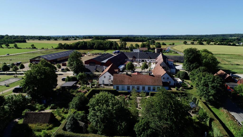 an aerial view of a large house with trees at Svabesholms Kungsgårds B&B och Pensionat Stenshuvud in Kivik