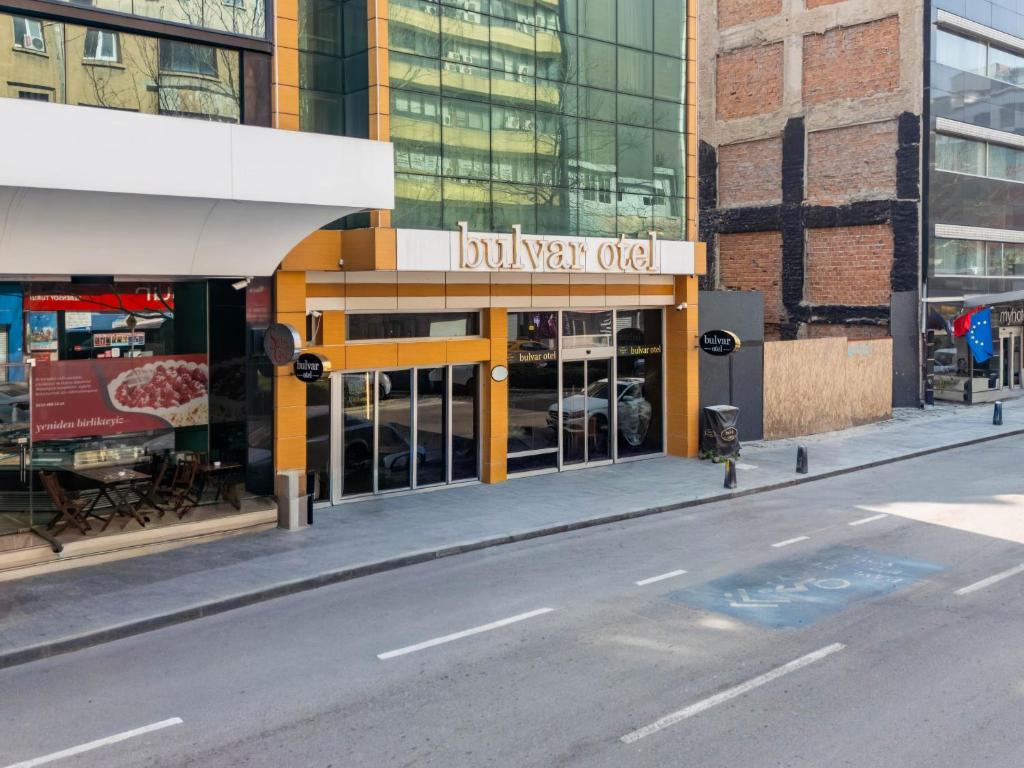 a building with a sign that reads boiler war office at Bulvar Hotel in İzmir