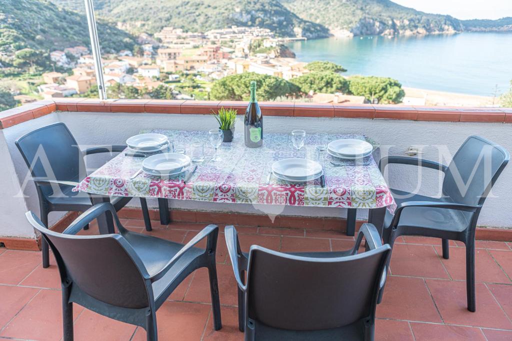 a table and chairs on a balcony with a view at Giglio Blu 1 in Campese