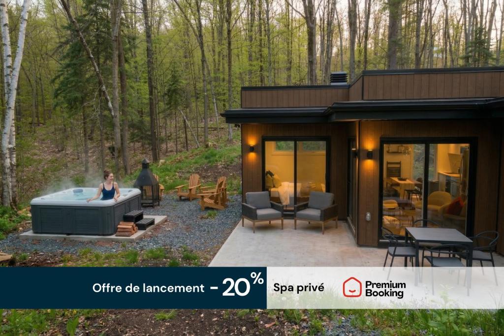 a woman sitting in a hot tub in a tiny house at Mini Chalet Assinie Spa Privé, Nature & Golf in Brownsburg