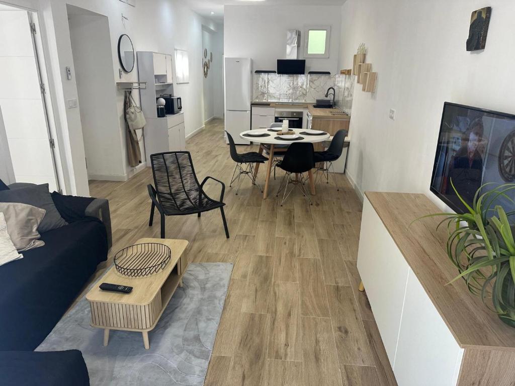 a living room with a couch and a table at Piso Loli in Águilas