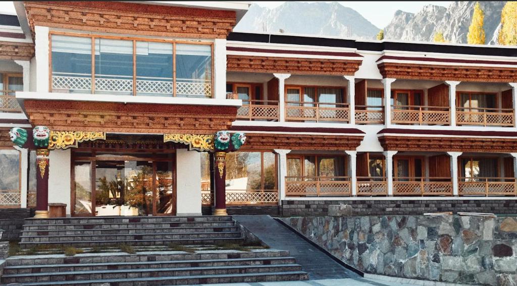 a large building with stairs in front of it at Kaldan Palace in Hundar