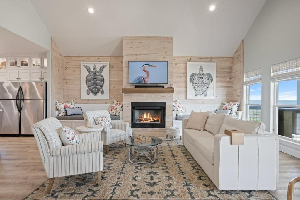 a living room with a couch and a fireplace at Gulf State home in Crystal Beach