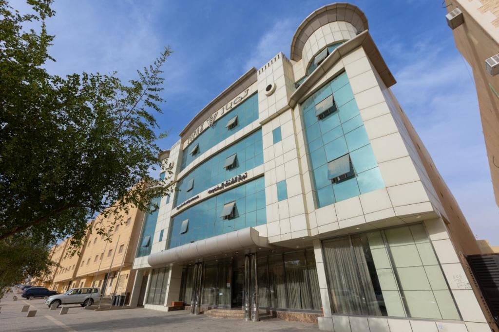 a building with a blue and white at Topaz Serviced Apartments in Riyadh