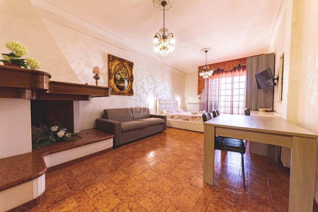 a living room with a couch and a table at Porto Cesareo - Appartamenti e camere in Porto Cesareo