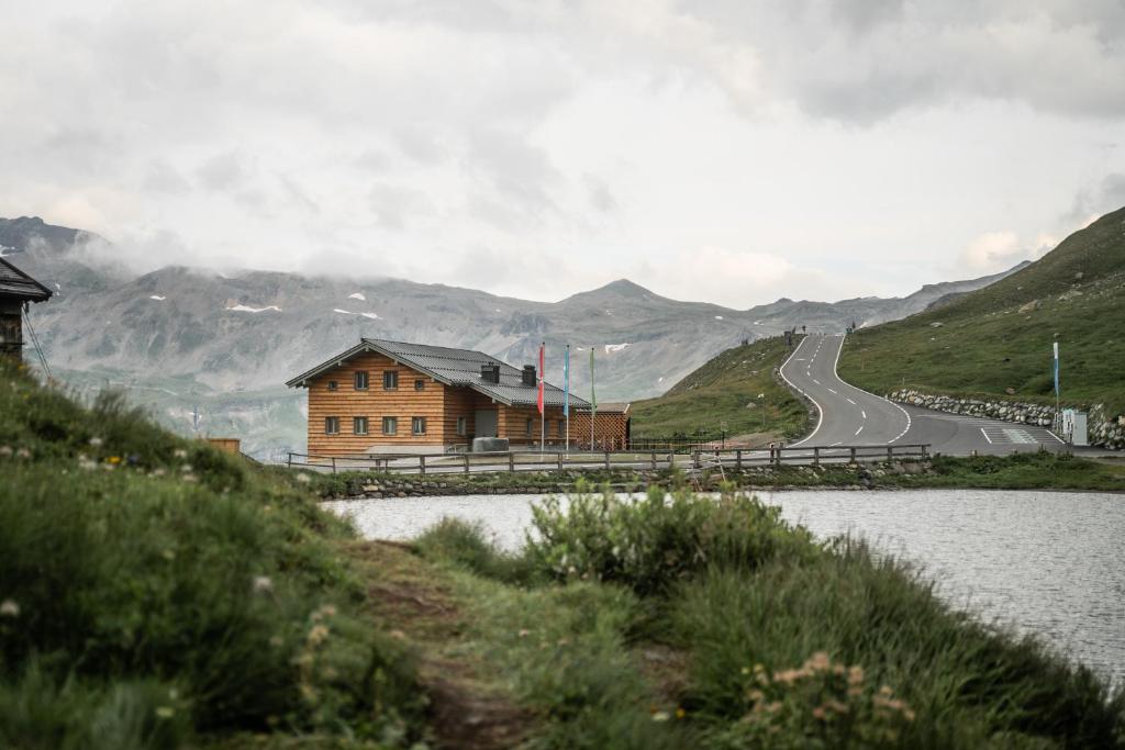 a house on a hill next to a road at FAT Mankei in Seidlwinkl