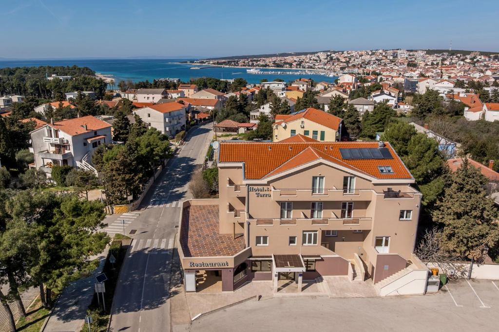 an aerial view of a house in a city at Hotel Terra Nova in Novalja