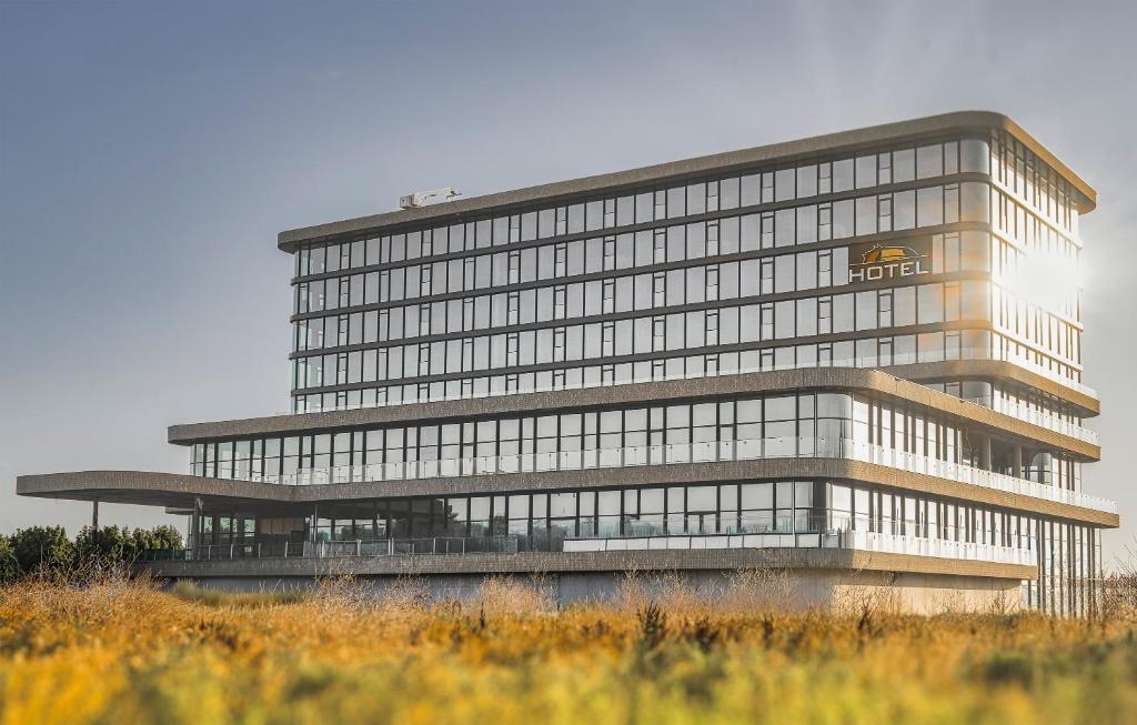 a large office building with a lot of windows at Van der Valk Hotel Woerden in Woerden